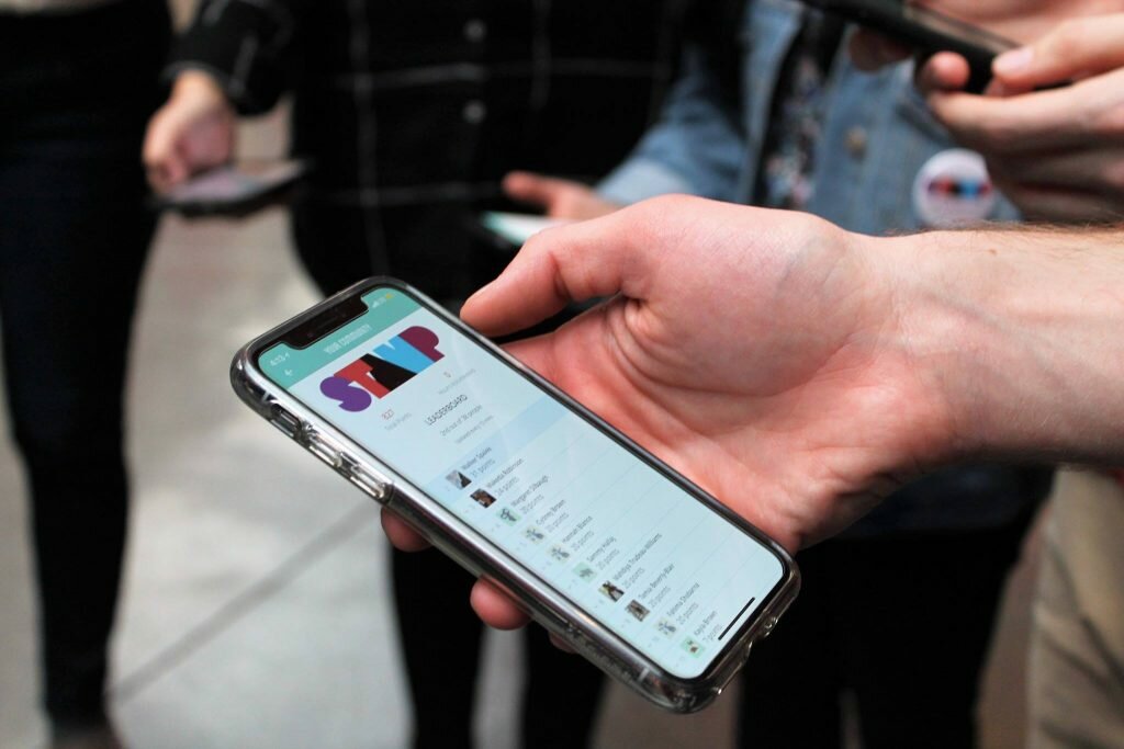 A teen using the STAMP app at a museum.